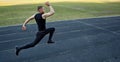 One caucasian male is doing a sprint start. running on the rubber track. Track and field runner in sport uniform. energetic Royalty Free Stock Photo