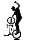 Man bmx acrobatic figure silhouette Royalty Free Stock Photo