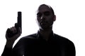 One caucasian man holding gun portrait silhouette Royalty Free Stock Photo