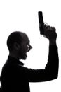 One caucasian man holding gun portrait silhouette Royalty Free Stock Photo