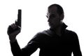 One caucasian man holding gun portrait silhouette Royalty Free Stock Photo