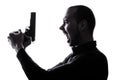 One caucasian man holding gun portrait silhouette Royalty Free Stock Photo