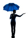 Woman holding umbrella palm gesture silhouette