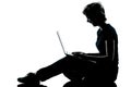 One young teenager girl silhouette computer computing laptop la Royalty Free Stock Photo