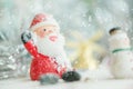 One ceramic santa claus Merry Christmas text on snowfall background. Lovely Merry Christmas and Happy New Year 2018 on snowfall Royalty Free Stock Photo