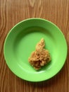 One chicken wing on a green plate Royalty Free Stock Photo