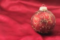 One christmas bulb on a red background