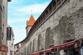 One of the city gate towers rises above the medieval wall surrounding the ancient city of Tallinn, Estonia