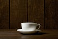 One classic coffee or tea cup on a dark wooden background