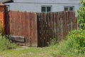 One closed old rural brown wooden gate