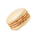 One coconut yellow macaron isolated on white. Sweet meringue-based confection Royalty Free Stock Photo