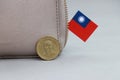 One coin of Taiwan fifty dollars money on obverse, portrait of Dr.Sun Yat-Sen, first president and mini Taiwan flag stick on the