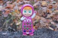 one colored plastic toy phone in the shape of a doll Royalty Free Stock Photo