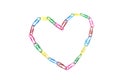 One colorful heart from paperclips on the white