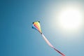 One colorful kite flying in sky on sunny day Royalty Free Stock Photo