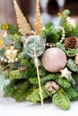 One colorful lollipop on decorated Christmas tree, top view,balls, stars, cones, hearts, gold toys Royalty Free Stock Photo