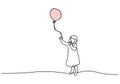 One continuous line drawing of little girls playing balloons. Cute child girl is holding a waving balloon in the wind isolated on Royalty Free Stock Photo