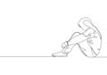 One continuous line drawing of young despair male teen sitting down on the floor wearing hoodie in the city street