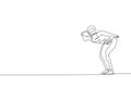 One continuous line drawing of young sporty man soccer freestyler practice hold the ball with nape in the street. Football