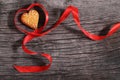 One cookies and heart shaped red ribbon Royalty Free Stock Photo