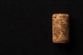 One cork stopper for wine bottle over black background Royalty Free Stock Photo