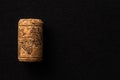 One cork stopper for wine bottle over black background Royalty Free Stock Photo