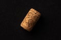 One cork stopper for wine bottle over black background Royalty Free Stock Photo