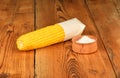One corn cob and salt on vintage wood Royalty Free Stock Photo