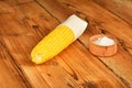 One corn cob and salt on vintage wood Royalty Free Stock Photo