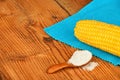 One corn cob and salt on vintage wood Royalty Free Stock Photo