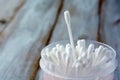 One cotton swab stand out from many cotton swabs in a round cont Royalty Free Stock Photo