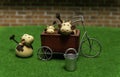 One Cow on green grass and two Cows in the tricycle with steel bucket of water Royalty Free Stock Photo
