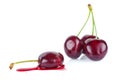 One crushed and three whole ripe cherry isolated on a white background Royalty Free Stock Photo