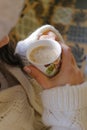 One cup cappuccino with woman hand