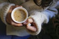 One cup cappuccino with woman hand