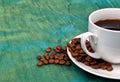 One cup of coffee with coffee beans around it Royalty Free Stock Photo