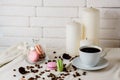 One cup of fragrant coffee in a romantic setting. Candle and coffee beans. Royalty Free Stock Photo