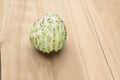 One custard apple on wooden board Royalty Free Stock Photo