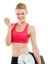 One day soon, youll be someone elses fitspiration. Studio shot of a woman holding an apple and a scale.