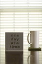 One day at a time coffee and tea inspiration Royalty Free Stock Photo