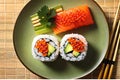 One Delectable Sushi Roll Topped with Glossy Delicate Salmon Roe - Viewed from Above, Illuminated by Light