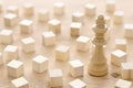 One different chess game pawn among wooden blocks. Individuality, leadership and uniqueness concept.