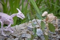 one dinosaur eats another, toy skeletons of dinosaurs in nature