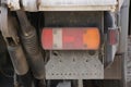 Dirty color rear light on a gray truck Royalty Free Stock Photo