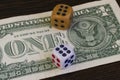 One dollar banknote and dice