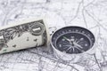 One-dollar bill, compass and map Royalty Free Stock Photo
