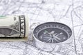One-dollar bill, compass and map Royalty Free Stock Photo