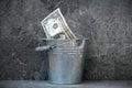 One Dollar Bill in Silver pail or a metal Bucket Royalty Free Stock Photo
