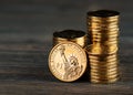 One dollar coin and gold money Royalty Free Stock Photo