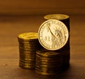 One dollar coin and gold money Royalty Free Stock Photo